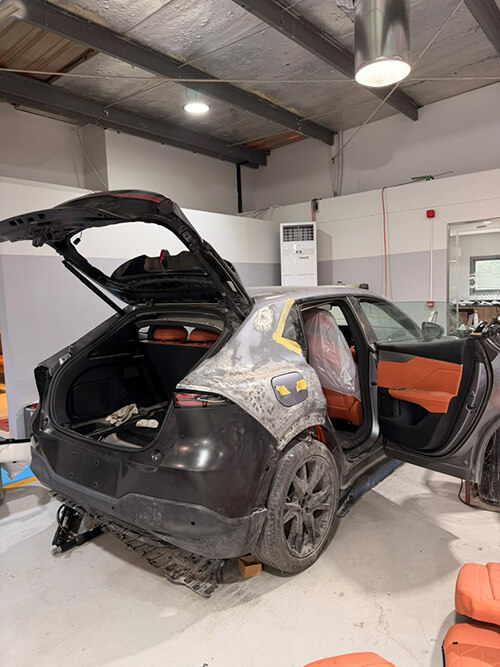 Accident-Damaged Luxury Car Repair back