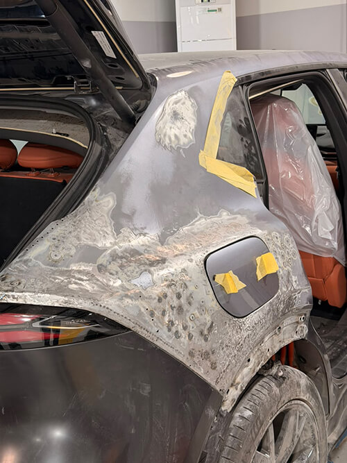 Accident-Damaged Luxury Car Repair side